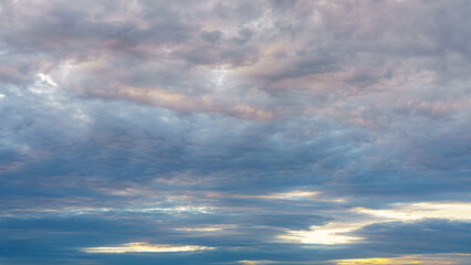 Layered altostratus and stratocumulus clouds fill the sky 