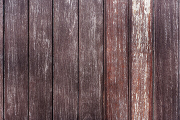 A rustic background of vertical, weathered brown wood planks. An aged, textured wooden surface with a distressed, vintage feel.