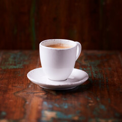 Cup of coffee on wooden background. Soft focus. Copy space	