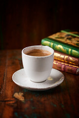 Cup of coffee on rustic wooden background. Soft focus. Copy space	