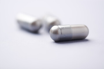 Naklejka premium BCAA amino acids tablets. Nutrition for bodybuilding. Fitness supplements on bright background. Soft focus. Copy space. 