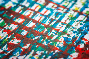 Extreme close up of colorful acrylic paint texture showing brush strokes. Selective focus.