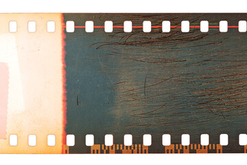 Dusty and grungy 35mm film texture or surface. Perforated scratched camera film isolated on white...