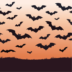 Fototapeta premium A swarm of black bat silhouettes flying against an orange gradient sunset sky for Halloween.