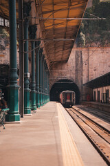 Train engine at a train station platform, track track railway scene