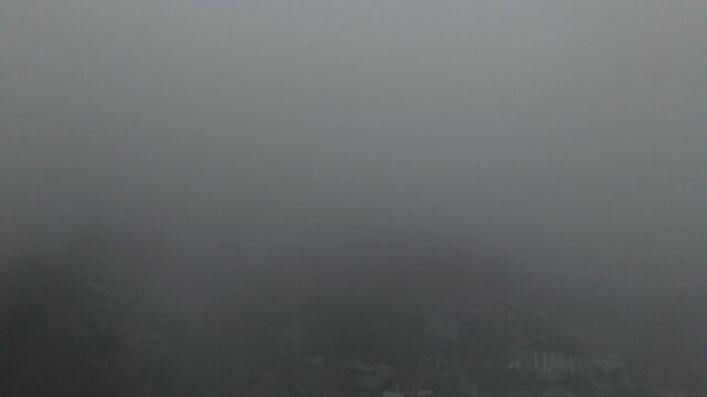 Rainy, misty days over town in Morelos, Mexico, from drone view