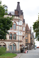 City street view of old historical buildings with architectural details. European urban landscape. Travel landmark exterior.