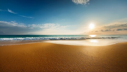 the beach is a peaceful place where golden sand stretches to the horizon and the waves gently touch the shore the sun shines in the sky and a fresh breeze carries the scent of salt