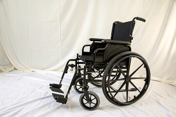 Fototapeta premium Wheelchair black isolated on white