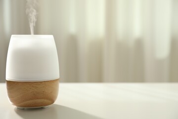 Modern aroma lamp on light table indoors. Space for text