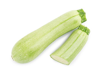 Fresh whole and cut zucchinis isolated on white, top view