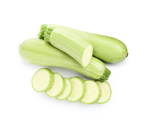 Fresh whole and cut zucchinis isolated on white, top view