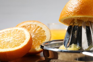 Making juice. Juicer and fresh fruits on table, closeup