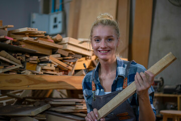 Carpenter is working at workshop.