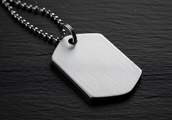 A blank silver dog tag on a dark textured background, symbolizing military service or personal identification mockup, commercial usage