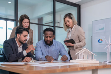multiracial business team,executives board group working on corporate property investment having discussion on conference table in meeting room