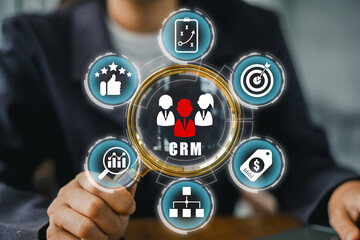 Business professional interacting with a CRM interface, showcasing customer relationship management and data analysis tools.