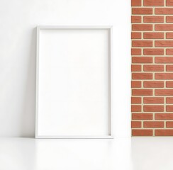 Empty White Frame Against White Wall and Brick Pattern