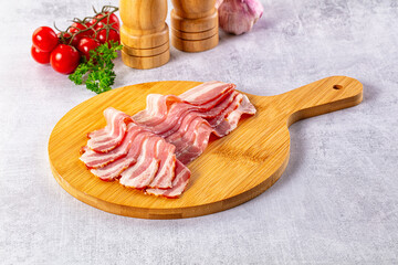 Raw bacon pork meat slices