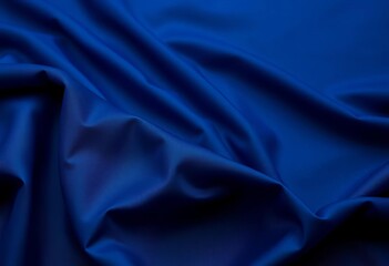 Obraz premium Deep indigo fabric draped elegantly, soft folds and shadows, folds, texture