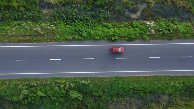 Aerial Top View of Busy Indian Road with Moving Vehicles. Top View of Indian Village Road with Cars and Motorbikes. Beautiful Road of a Village in India.