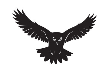 Black silhouette of an owl in flight with wings spread wide
