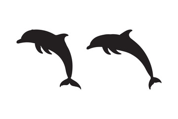 Two black silhouettes of dolphins leaping out of water