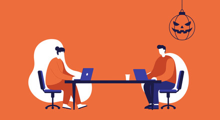 Two colleagues work diligently on laptops at a table, with a festive Halloween jack-o'-lantern decoration hinting at the season. Represents professional productivity and seasonal workplace themes.
