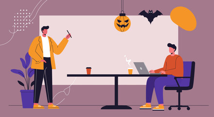 Two men collaborating in a modern office space, one presenting while the other works on a laptop, with festive Halloween decorations. Represents creative teamwork and seasonal office ambiance.
