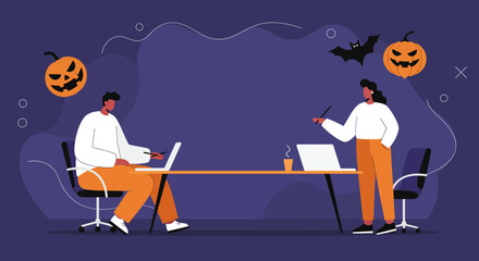 Colleagues working with laptops in an office decorated for Halloween. This seasonal business setting conveys collaboration and festive productivity.