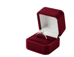 Elegant diamond ring in an open red velvet jewelry box isolated on transparent background