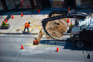 Installation of underground electric cable in the city to the restaurant