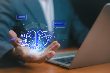 Businessman holding virtual AI digital brain hologram with chat messages, concept of artificial intelligence, machine learning, automation, innovation, and futuristic business technology.