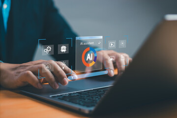 Businessman using artificial intelligence assistant on laptop with virtual UI interface. Concept of AI technology, automation, innovation and digital transformation