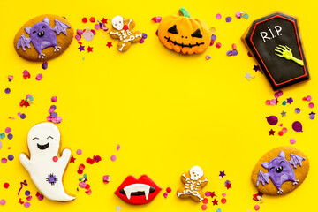Layout of Halloween gingerbread biscuits with pumpkins, top view