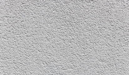 Textured abstract texture of a light gray concrete wall.