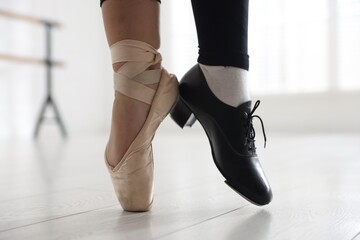Teenage girl in tap and pointe shoe indoors, closeup