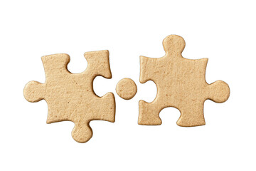 Fototapeta premium Two light beige puzzle pieces, slightly textured, fitting together