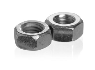Metal hex nuts on mirror surface isolated on white. Hardware tool