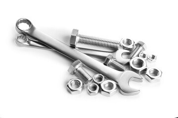 Many metal wrenches, bolts and nuts isolated on white