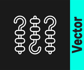 White line Grilled shish kebab on skewer stick icon isolated on black background. Meat kebab on skewer stick. Picnic with grilled meat. Vector