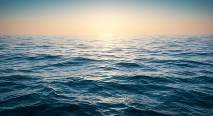 Obraz premium Serene blue ocean waves reflecting the golden glow of a peaceful sunrise on the horizon