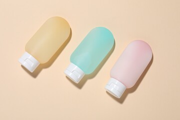 Cosmetic products on beige background, flat lay. Mockup for design