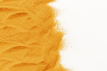 Frame of yellow sand texture on white background, close up top view. Abstract sand surface