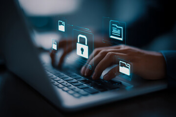 Cybersecurity concept with glowing digital icons of locks and documents over a person typing on a laptop