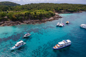 Aerial view of Koh Racha Yai Island with many tour boats, yacht, catamaran and longtail boat...