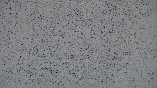 Minimalist Grey Textured Background: Slow Dolly Shot of a Porous Concrete Block Wall