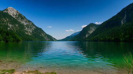 Obraz premium Serene Alpine Lake with Green Forest and Mountain Landscape 