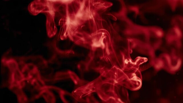 Dynamic red smoke patterns swirling with fluid motion and vibrant color