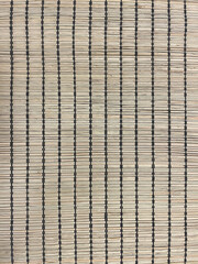Close-up of bamboo mat texture with vertical black threads. Natural woven surface in beige tones, rustic eco-friendly design for home decor, flooring, crafts, background